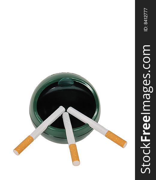 Three unlit cigarettes in an open lid ashtray. Three unlit cigarettes in an open lid ashtray.
