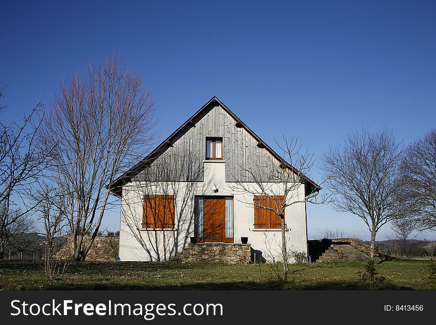 Traditional house in garden in the middle of the countryside