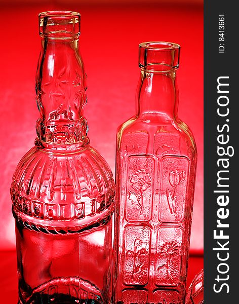 Two bottles on red