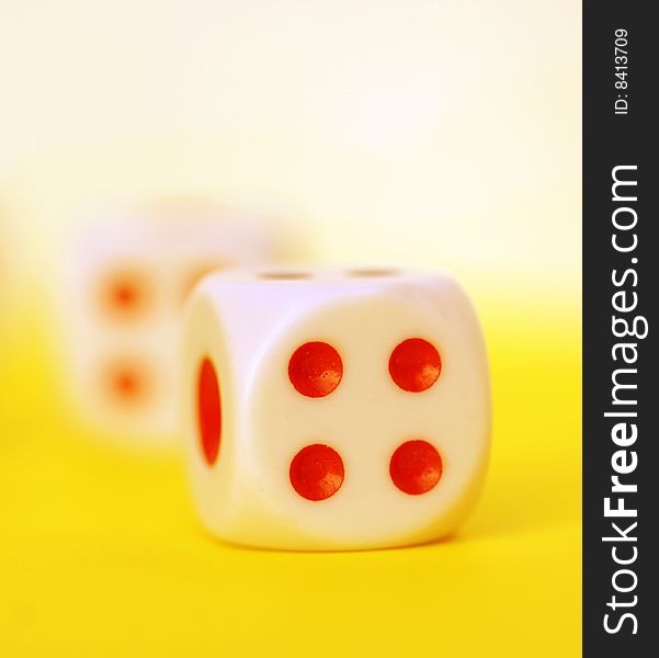 Square dice on color background