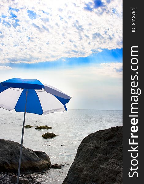 Marine beach with an sun umbrella