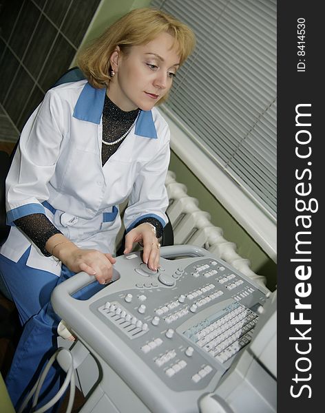 Female doctor examining by ultrasonic scan. Female doctor examining by ultrasonic scan