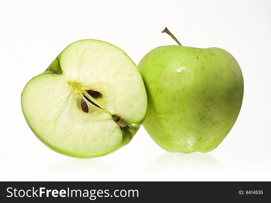 One apple and a half on white background