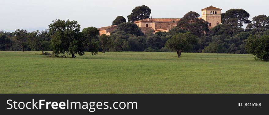 Property with a big ancient house in a meadow in Majorca in Spain