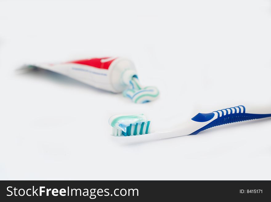 Toothbrush with tube isolated on white
