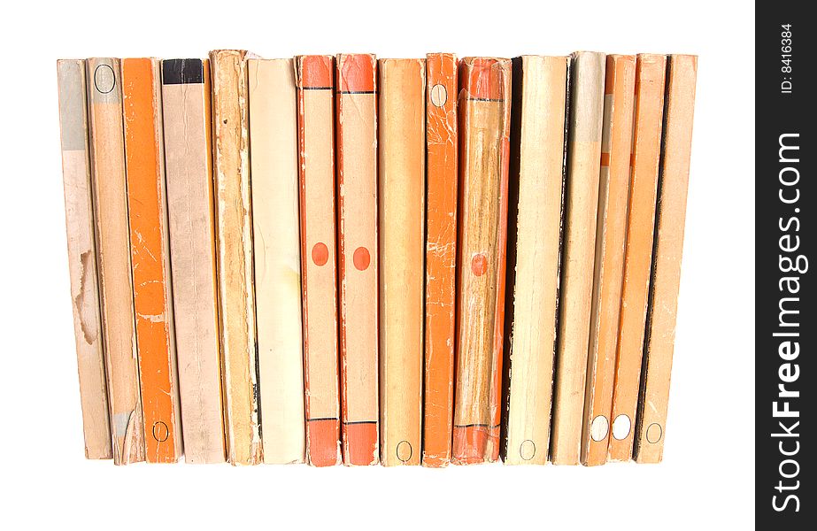 Old paperback books isolated against a white background