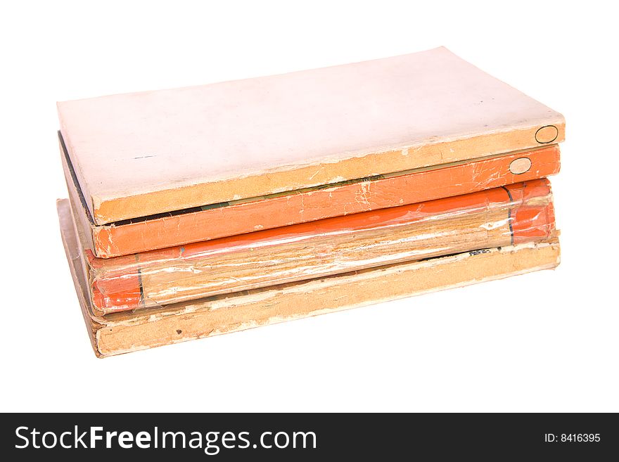 Old paperback books isolated against a white background