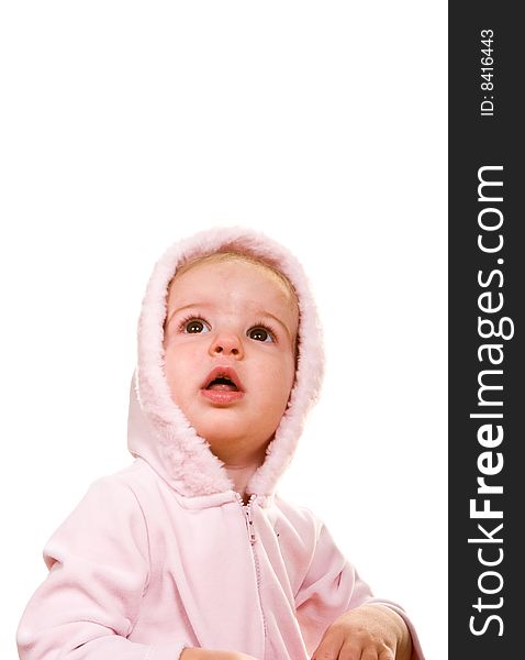 A cute baby in a pink jacket and hood on white. A cute baby in a pink jacket and hood on white