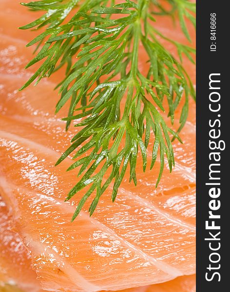 Extreme closeup of smoked salmon and dill.