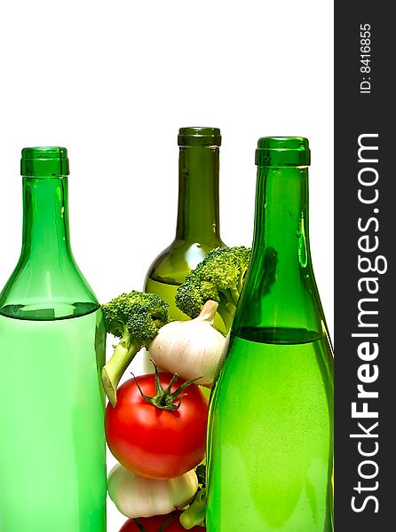 three wine bottles and vegetables