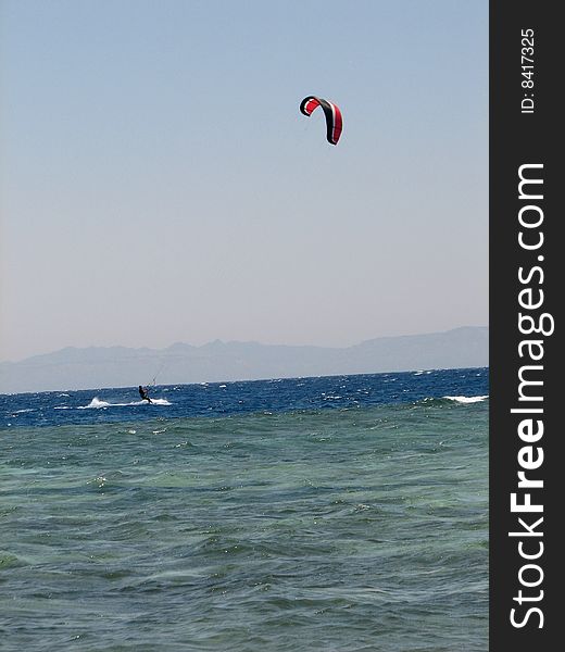 A kiteboarder on the Red Sea on the Sinai Peninsula in Egypt. A kiteboarder on the Red Sea on the Sinai Peninsula in Egypt