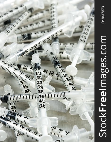 Images medical syringes on metal background. Images medical syringes on metal background