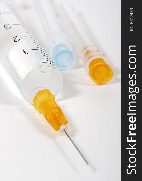 Syringe with hypodermic needle on white background. Syringe with hypodermic needle on white background
