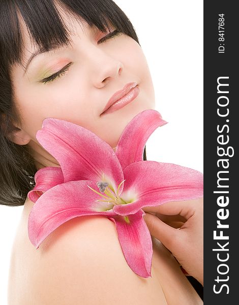 Young woman with lily flower on the white background