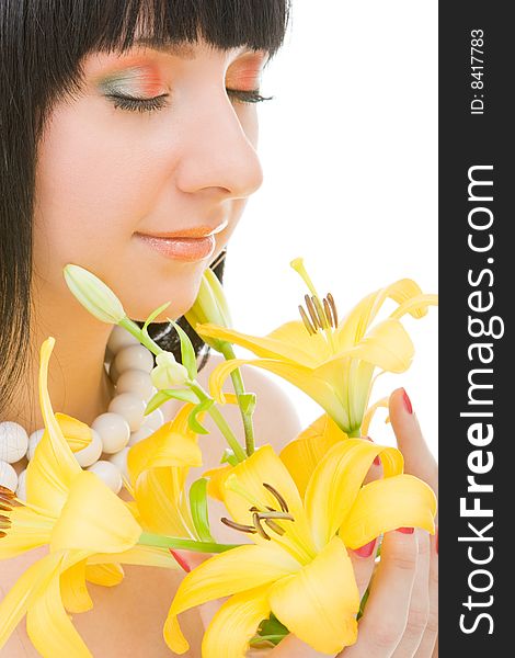 Young woman with lily flower on the white background