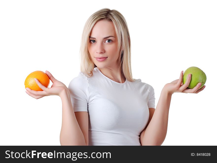 Portrait of beautiful woman with green apple and orange