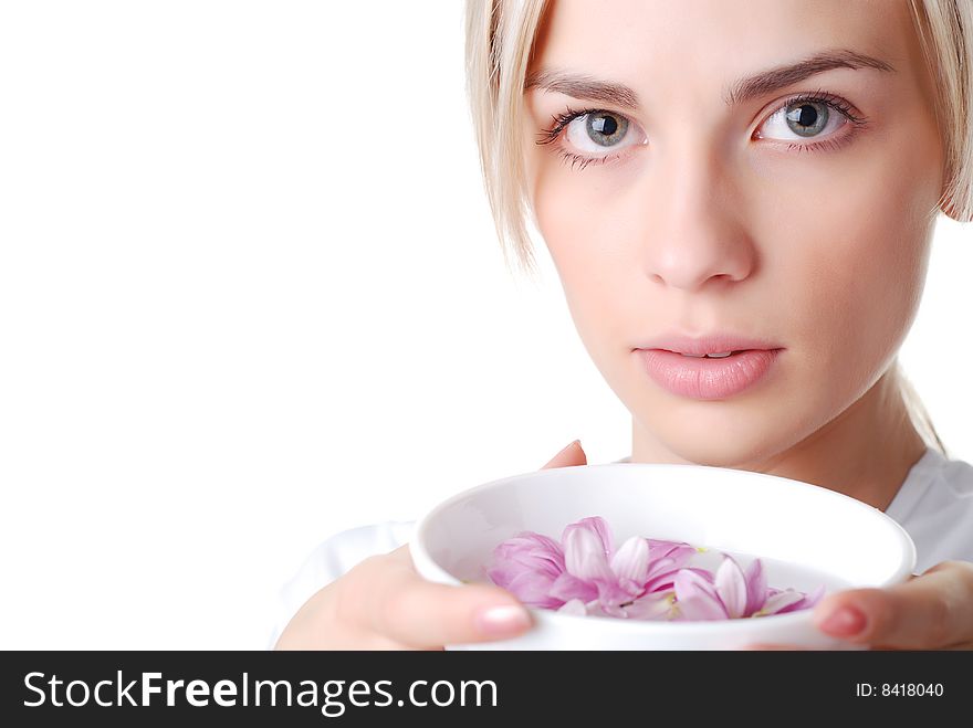 Beautiful blond woman with bowl of flowers. Beautiful blond woman with bowl of flowers