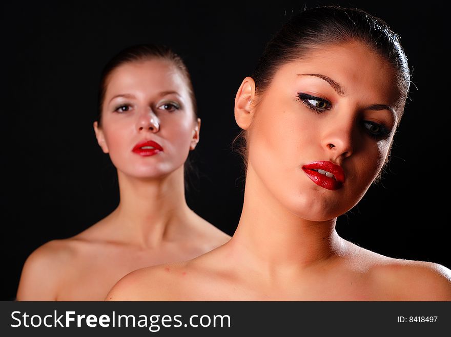 Two women with red lips