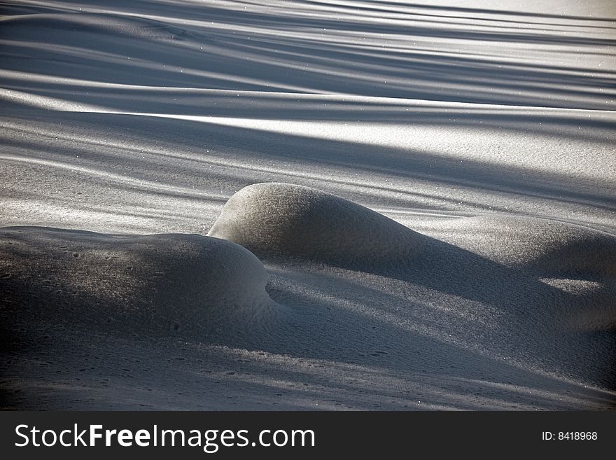 Snow covered field with sharp shadows. Snow covered field with sharp shadows.