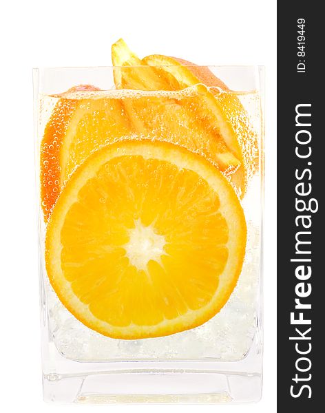 Refreshing carbonated soda poured over fresh orange slices for a refreshing drink copy space. Refreshing carbonated soda poured over fresh orange slices for a refreshing drink copy space