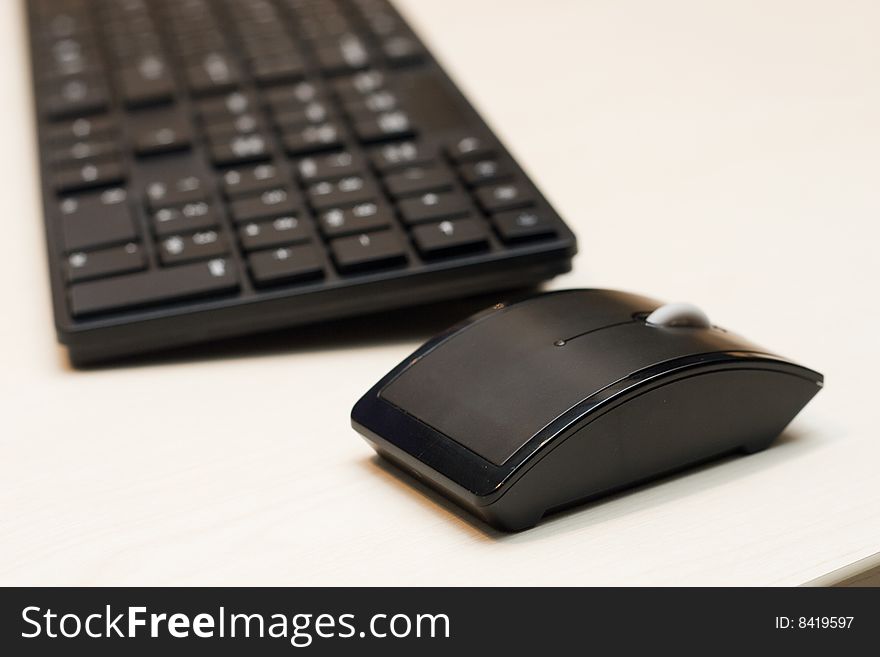 Components of a personal computer: mouse, keyboard on desk