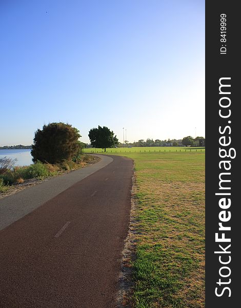 A jogging track near lake. A jogging track near lake