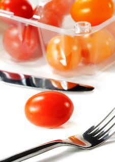 Fork And Knife With Cherry Tomato Stock Photos Fork And Knife With Cherry Tomato Stock Photos