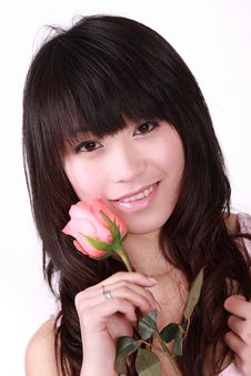 Girl Holds A Pink Rose Stock Images