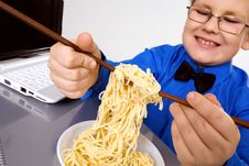 Hungry Boy Eating Chinese Noodles With Sticks Royalty Free Stock Image Hungry Boy Eating Chinese Noodles With Sticks Royalty Free Stock Image