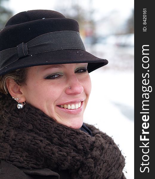 Smiling girl with brown hat