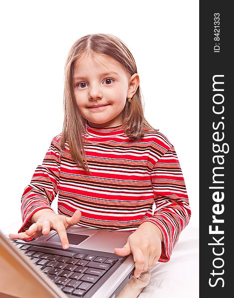 Studio photo of little girl with laptop