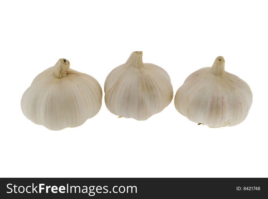 Three heads of garlic isolated over white