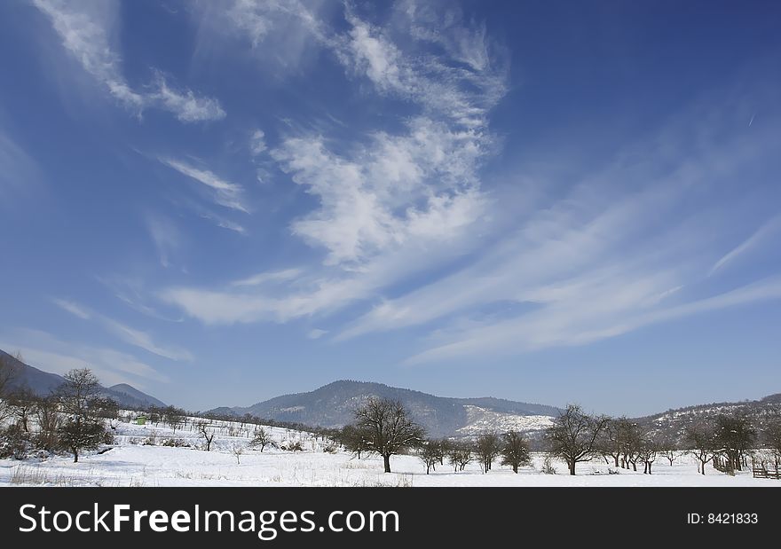 Winter landscape with beautiful clouds