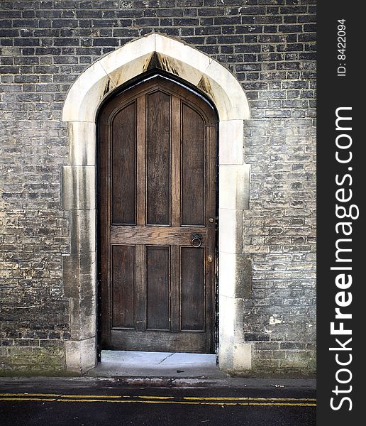 A gothic arched door from Cambridge in the united kingdom. A gothic arched door from Cambridge in the united kingdom