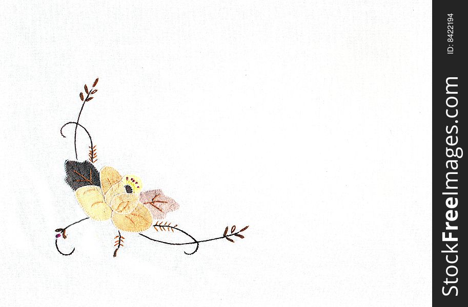 Embroidered flower ornament on white background. Embroidered flower ornament on white background.