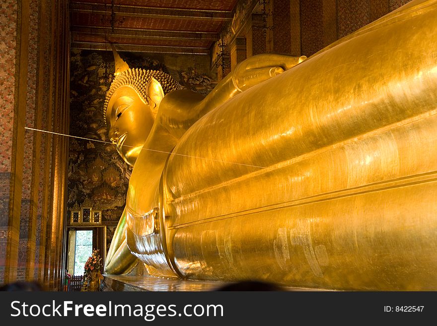 The reclining Buddha at Wat Pho in Bangkok, Thailand. Largest reclining Buddha in the world.
