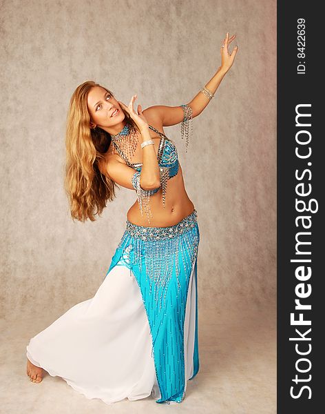 Beautiful long hair blonde woman in arabic dance costume. Beautiful long hair blonde woman in arabic dance costume