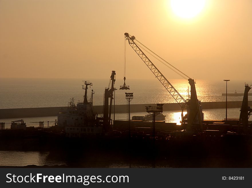 View of Genoa docks at the sunset