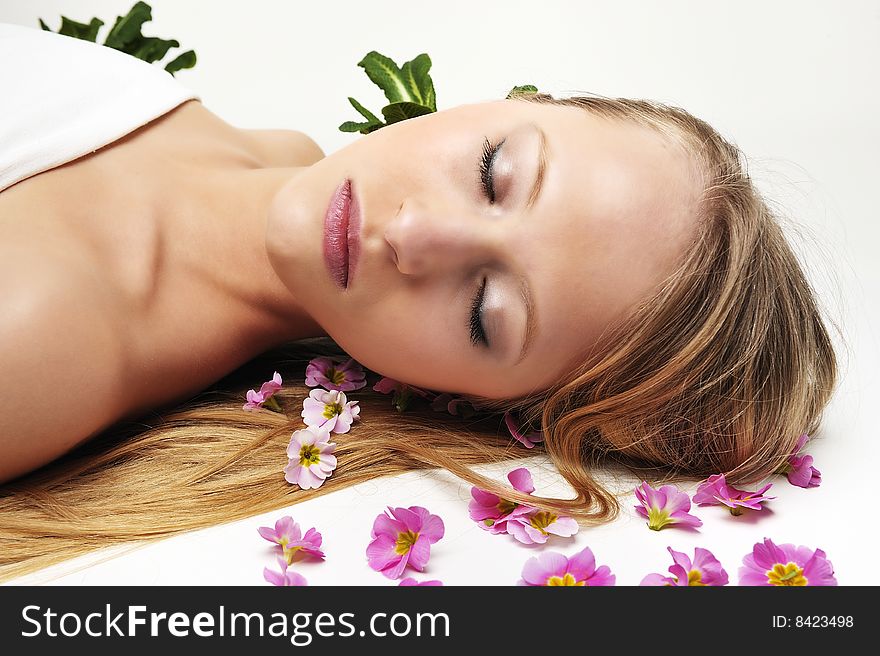 Beautiful blond woman having massage in spa
