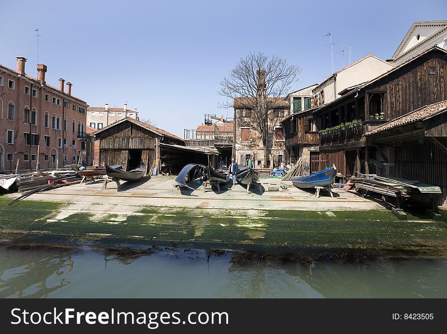 Canal in Venice in summer with blue sky