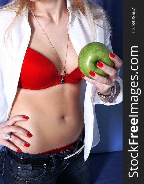 Girl in red bra with apple. Girl in red bra with apple