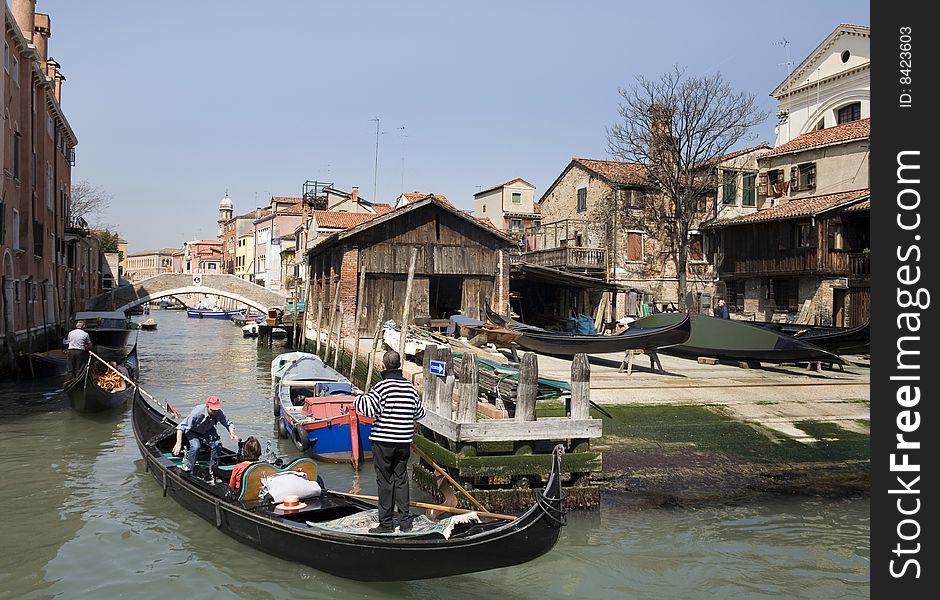 Canal in Venice in summer with blue sky