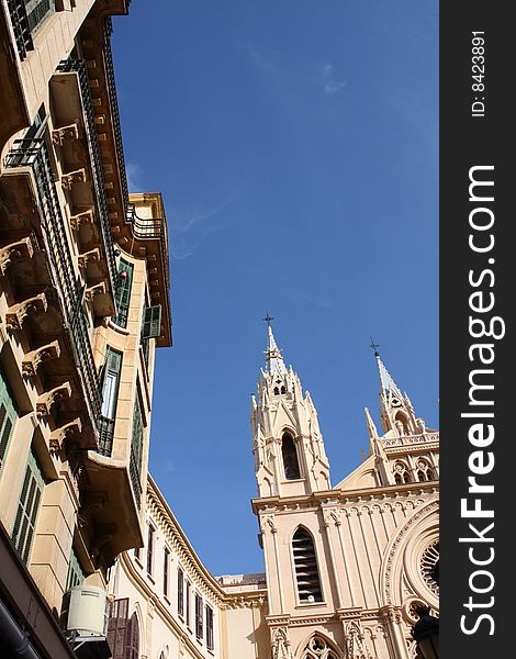 Facade of a church and surrounding buildings in the historic centre of Malaga on the southern coast of Spain. Facade of a church and surrounding buildings in the historic centre of Malaga on the southern coast of Spain.