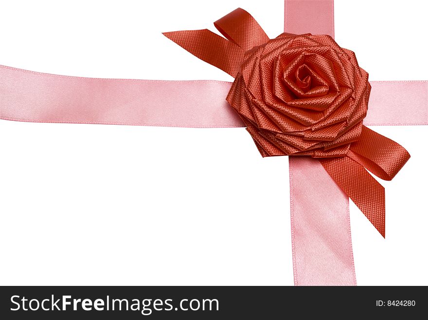 Gift packaging with ribbons and rose bow isolated on white