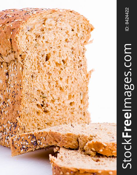 Loaf of wholemeal bread detail with slices. Loaf of wholemeal bread detail with slices