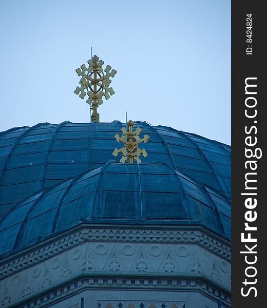 Orthodox church cupolas with golden crosses, against clear blue sky *RAW format available