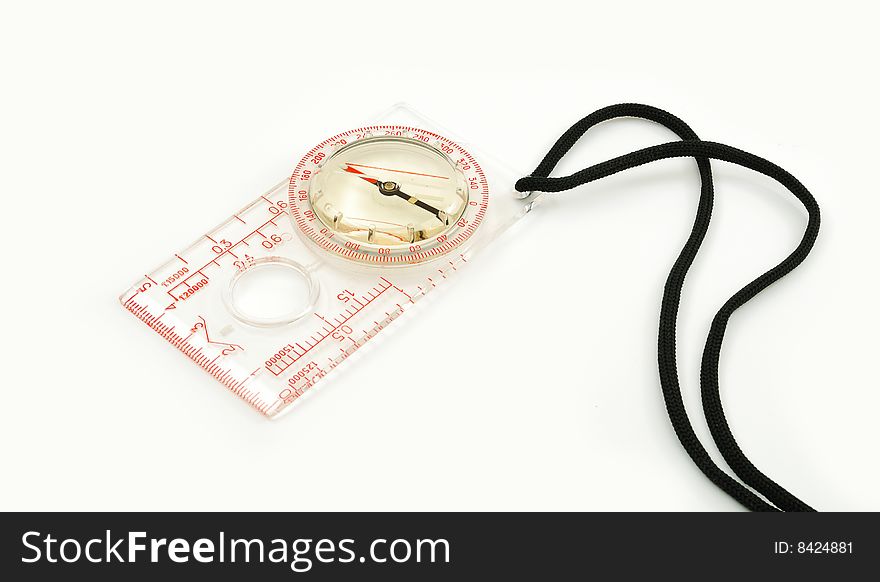 Transparent compass with a black thong on a white background