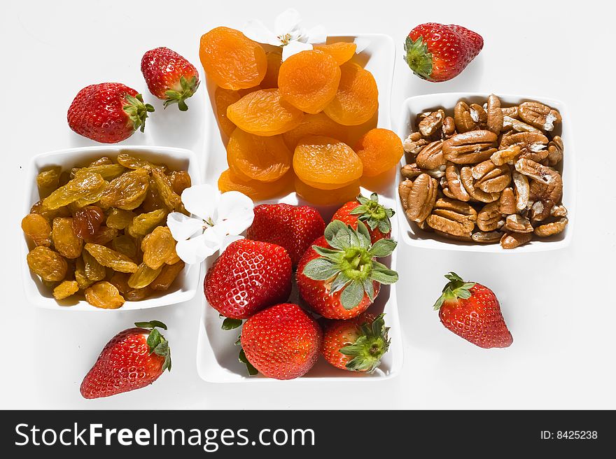 diet breakfast with dried apricots , ripe strawberry,raisins and nuts. diet breakfast with dried apricots , ripe strawberry,raisins and nuts