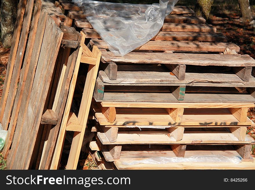Photo of pallets stacked in the yard. Photo of pallets stacked in the yard