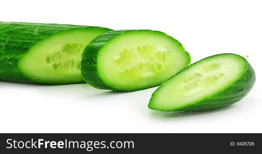 Slices of fresh green cucumber isolated on a white background